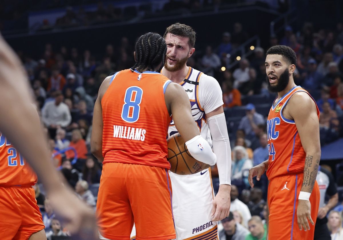 Nov 15, 2024; Oklahoma City, Oklahoma, USA;  Phoenix Suns center Jusuf Nurkic (20) and Oklahoma City Thunder forward Jalen Williams (8) get into an argument after a play during the second quarter at Paycom Center. Mandatory Credit: Alonzo Adams-Imagn Images