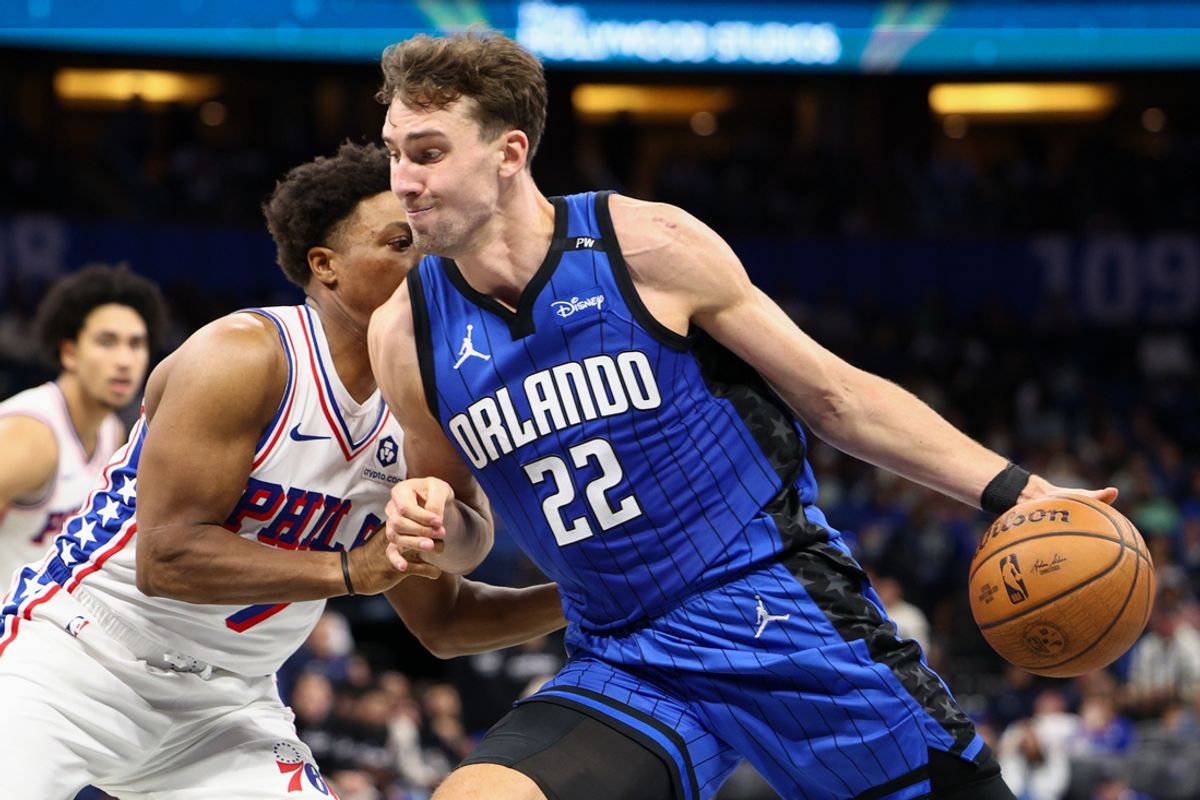 Nov 15, 2024; Orlando, Florida, USA; Orlando Magic forward Franz Wagner (22) is guarded by Philadelphia 76ers guard Kyle Lowry (7) in the third quarter at Kia Center. Mandatory Credit: Nathan Ray Seebeck-Imagn Images