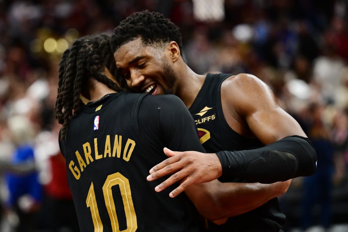 Nov 15, 2024; Cleveland, Ohio, USA; Cleveland Cavaliers guard Darius Garland (10) and guard Donovan Mitchell (45) celebrate after the Cavs beat the Chicago Bulls and moved to 14-0 on the season at Rocket Mortgage FieldHouse. Mandatory Credit: Ken Blaze-Imagn Images