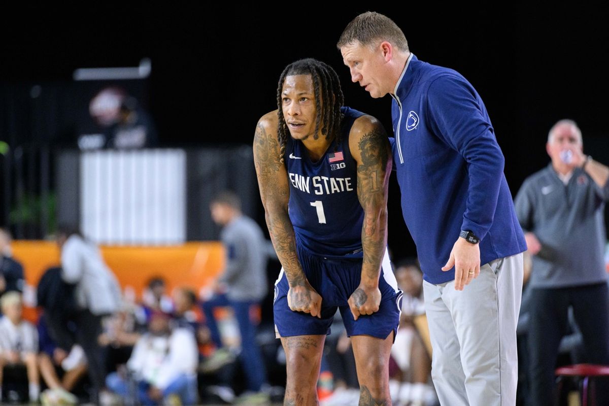 Nov 15, 2024; Baltimore, Maryland, USA; Penn State Nittany Lions guard Ace Baldwin Jr. (1) and head coach Mike Rhoades talk during the second half against the Virginia Tech Hokies at CFG Bank Arena. Mandatory Credit: Reggie Hildred-Imagn Images