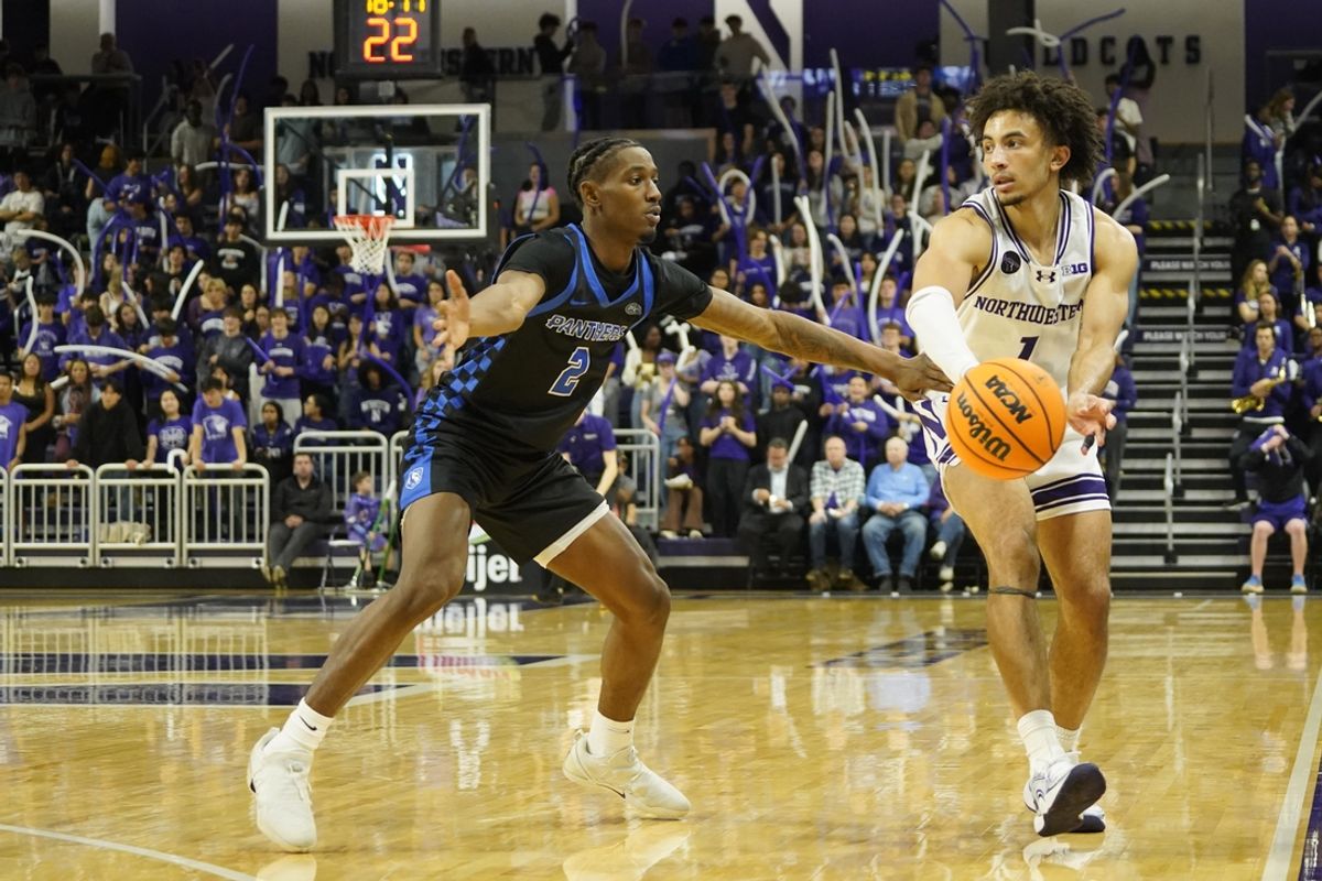 Nov 15, 2024; Evanston, Illinois, USA; Eastern Illinois Panthers guard Artese Stapleton (2) defends Northwestern Wildcats guard Jalen Leach (1) during the second half at Welsh-Ryan Arena. Mandatory Credit: David Banks-Imagn Images