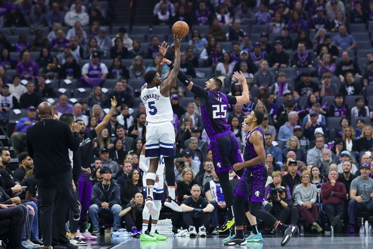 Nov 15, 2024; Sacramento, California, USA; Minnesota Timberwolves guard Anthony Edwards (5) shoots the ball against Sacramento Kings center Alex Len (25) during the first quarter at Golden 1 Center. Mandatory Credit: Sergio Estrada-Imagn Images