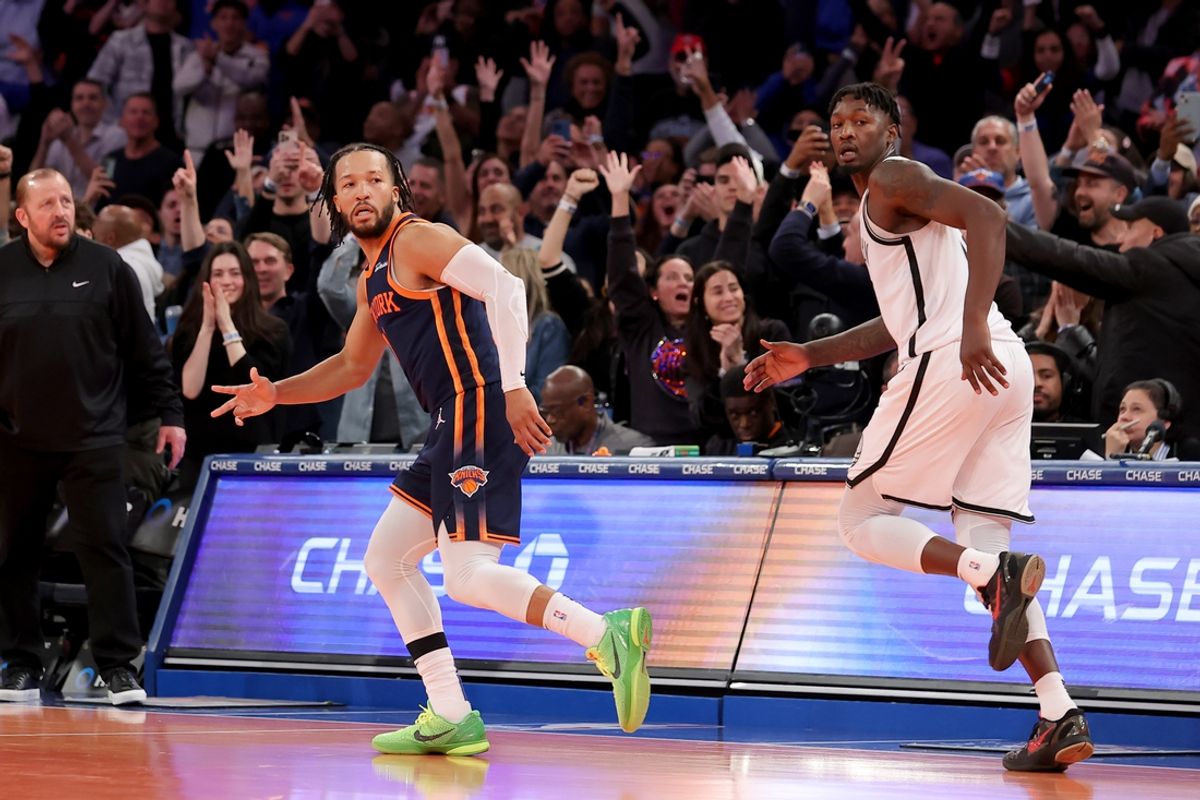 Nov 15, 2024; New York, New York, USA; New York Knicks guard Jalen Brunson (11) celebrates his game winning three point shot against Brooklyn Nets forward Dorian Finney-Smith (28) during the fourth quarter at Madison Square Garden. Mandatory Credit: Brad Penner-Imagn Images