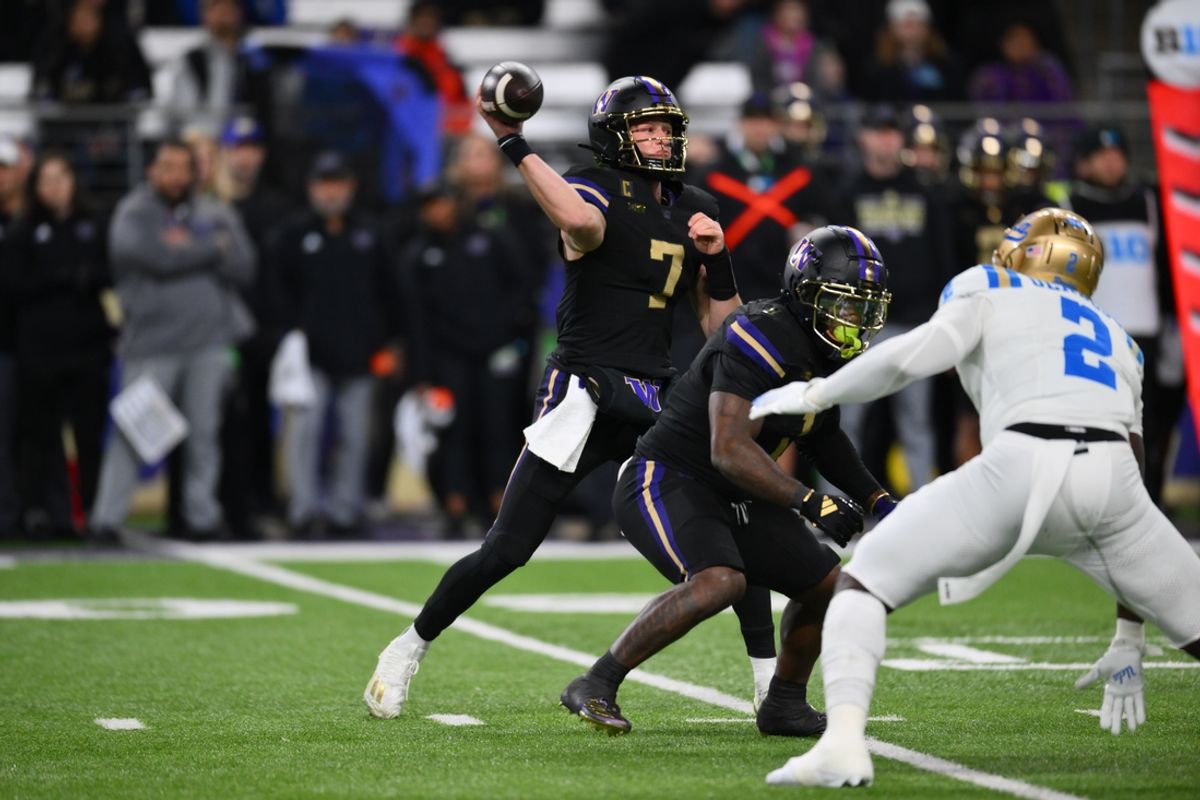 Nov 15, 2024; Seattle, Washington, USA; Washington Huskies quarterback Will Rogers (7) passes the ball against the UCLA Bruins during the first half at Alaska Airlines Field at Husky Stadium. Mandatory Credit: Steven Bisig-Imagn Images