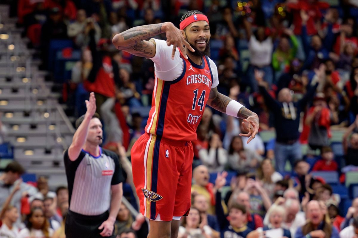 Nov 15, 2024; New Orleans, Louisiana, USA;  New Orleans Pelicans forward Brandon Ingram (14) celebrates a three point basket against the Denver Nuggets during the first half at Smoothie King Center. Mandatory Credit: Matthew Hinton-Imagn Images