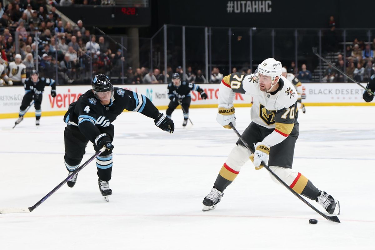 Nov 15, 2024; Salt Lake City, Utah, USA; Vegas Golden Knights left wing Tanner Pearson (70) shoots while pursued by Utah Hockey Club defenseman Juuso Valimaki (4) during the third period at Delta Center. Mandatory Credit: Rob Gray-Imagn Images