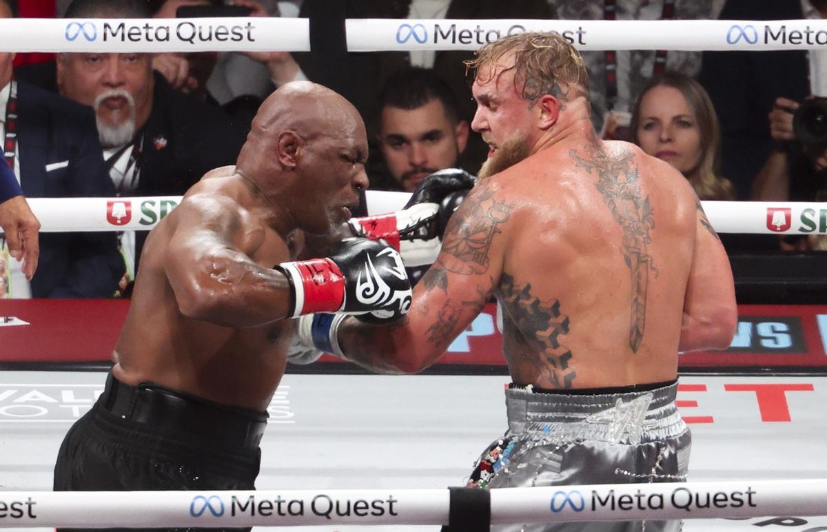 Nov 15, 2024; Arlington, Texas, UNITED STATES;  Mike Tyson (black gloves) fights Jake Paul (silver gloves) at AT&T Stadium. Mandatory Credit: Kevin Jairaj-Imagn Images