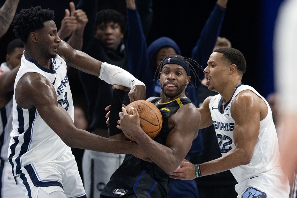 Nov 15, 2024; San Francisco, California, USA; Memphis Grizzlies forward Jaren Jackson Jr. (13) and guard Desmond Bane (22) force a jump ball with Golden State Warriors guard Buddy Hield (7) during the fourth quarter at Chase Center. Mandatory Credit: D. Ross Cameron-Imagn Images