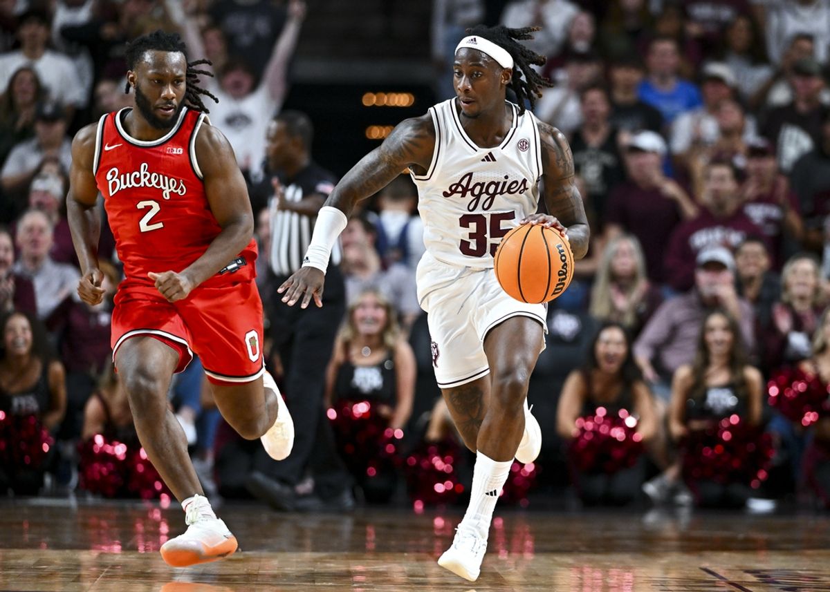 Nov 15, 2024; College Station, Texas, USA; Texas A&M Aggies guard Manny Obaseki (35) dribbles the ball as Ohio State Buckeyes guard Bruce Thornton (2) defends during the first half at Reed Arena. Mandatory Credit: Maria Lysaker-Imagn Images