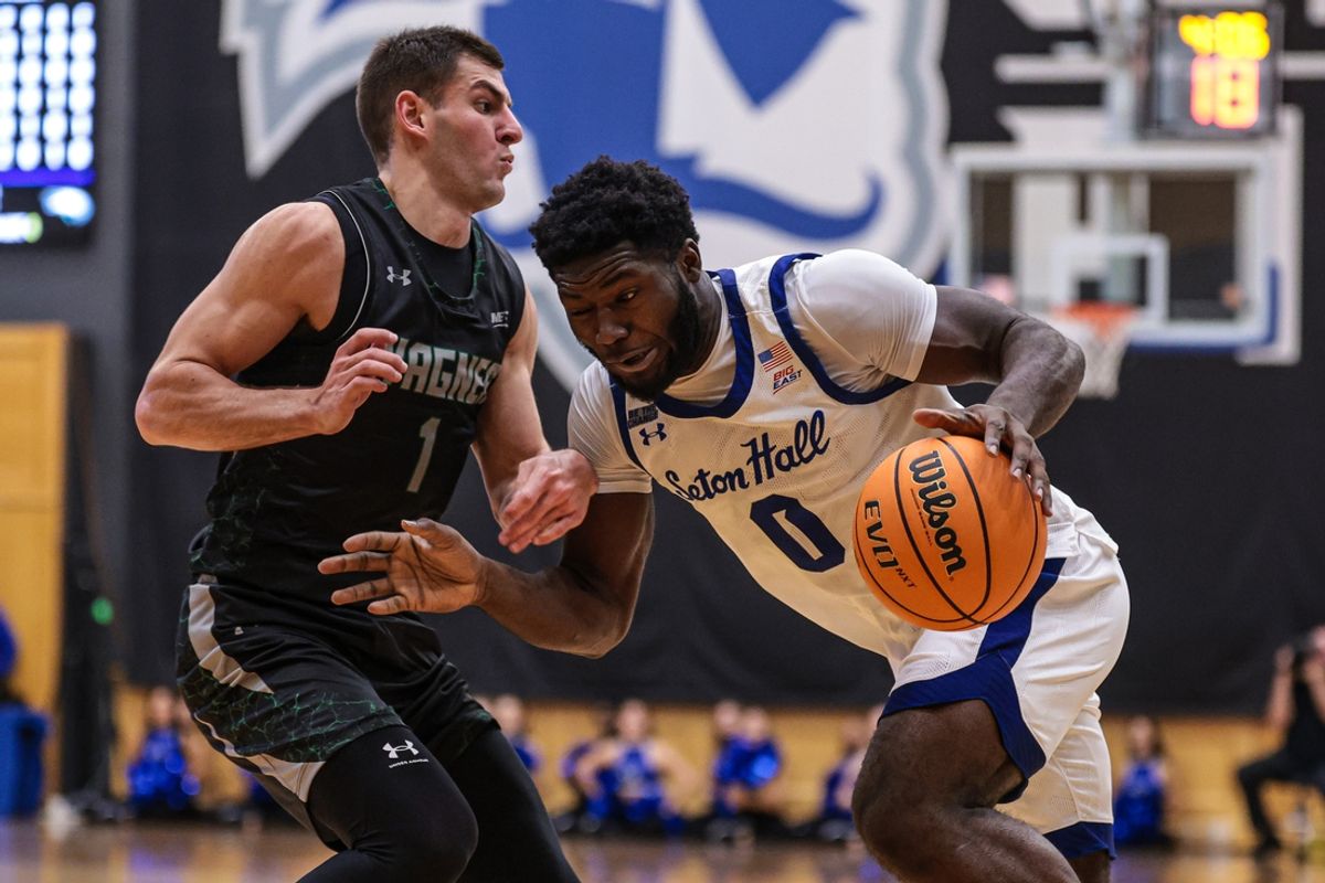 Nov 16, 2024; Newark, New Jersey, USA; Seton Hall Pirates guard Dylan Addae-Wusu (0) is defended by Wagner Seahawks guard Javier Ezquerra (1) during the first half at Walsh Gymnasium. Mandatory Credit: Vincent Carchietta-Imagn Images