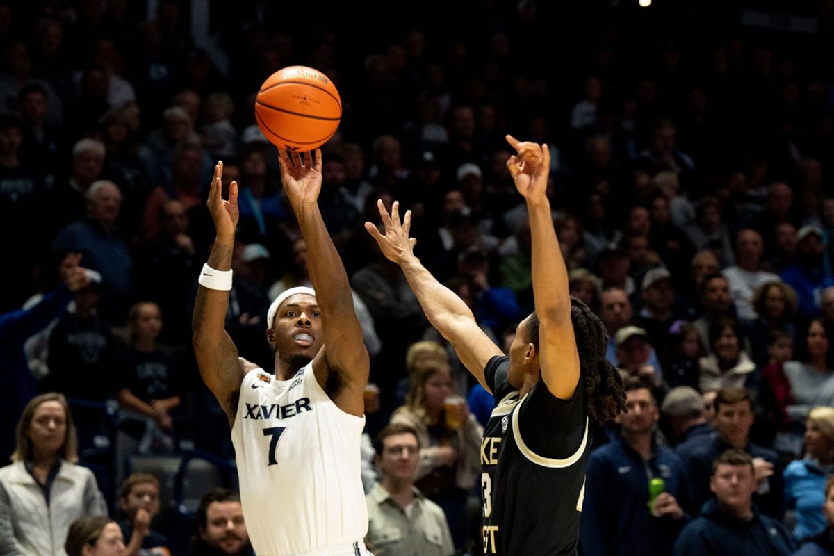 Xavier Musketeers guard Ryan Conwell (7) hits a 3-point basket over Wake Forest Demon Deacons guard Hunter Sallis (23) in the first half of the NCAA basketball game between Xavier Musketeers and Wake Forest Demon Deacons at the Cintas Center in Cincinnati on Saturday, Nov. 16, 2024.