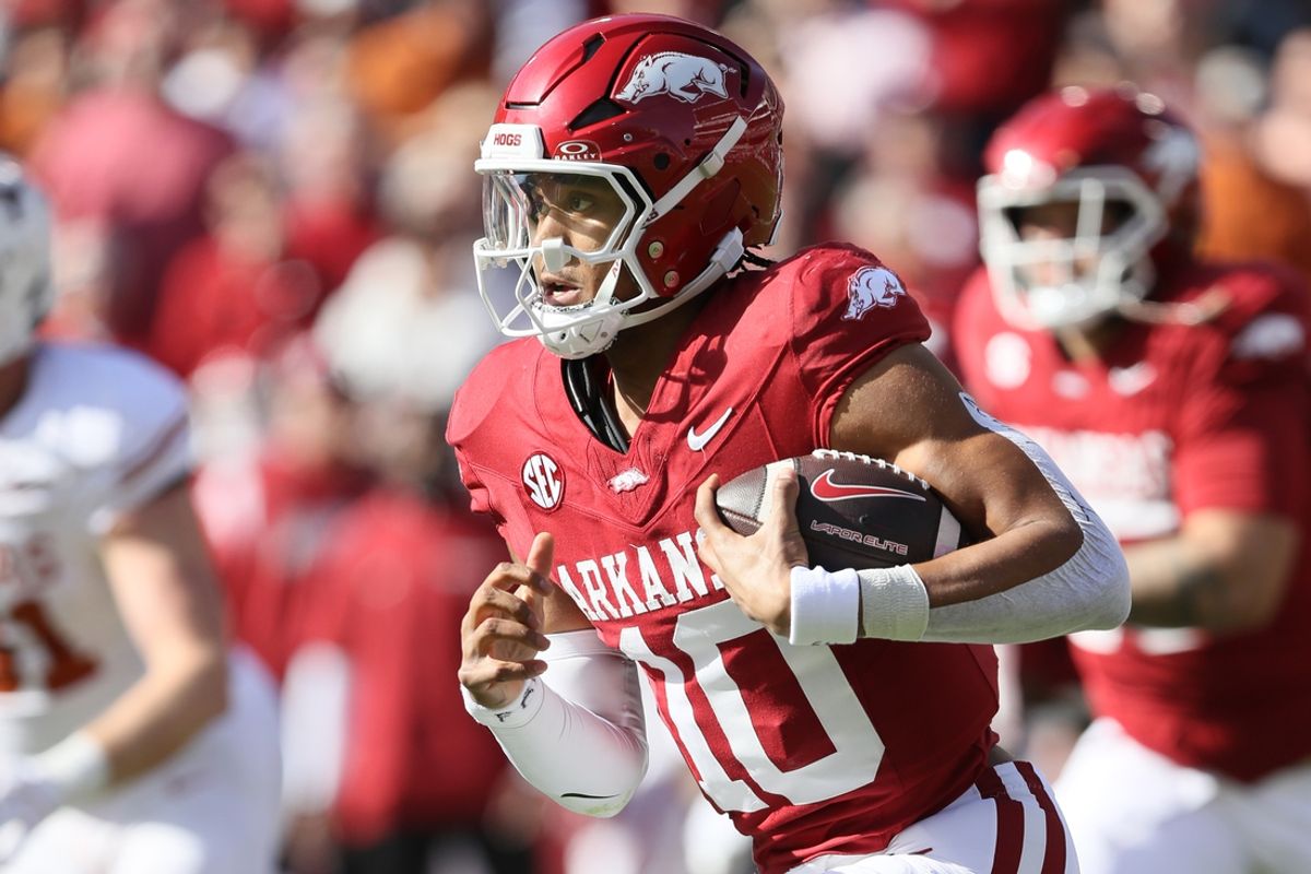 Nov 16, 2024; Fayetteville, Arkansas, USA; Arkansas Razorbacks quarterback Taylen Green (10) rushes in the first quarter against the Texas Longhorns at Donald W. Reynolds Razorback Stadium. Mandatory Credit: Nelson Chenault-Imagn Images