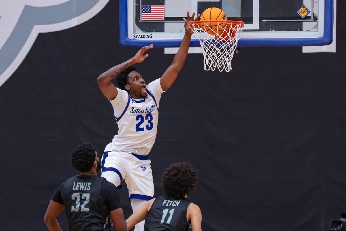 Nov 16, 2024; Newark, New Jersey, USA; Seton Hall Pirates center Emmanuel Okorafor (23) dunks the ball in front of Wagner Seahawks forward Keyontae Lewis (32) and forward Zavier Fitch (11) during the second half at Walsh Gymnasium. Mandatory Credit: Vincent Carchietta-Imagn Images