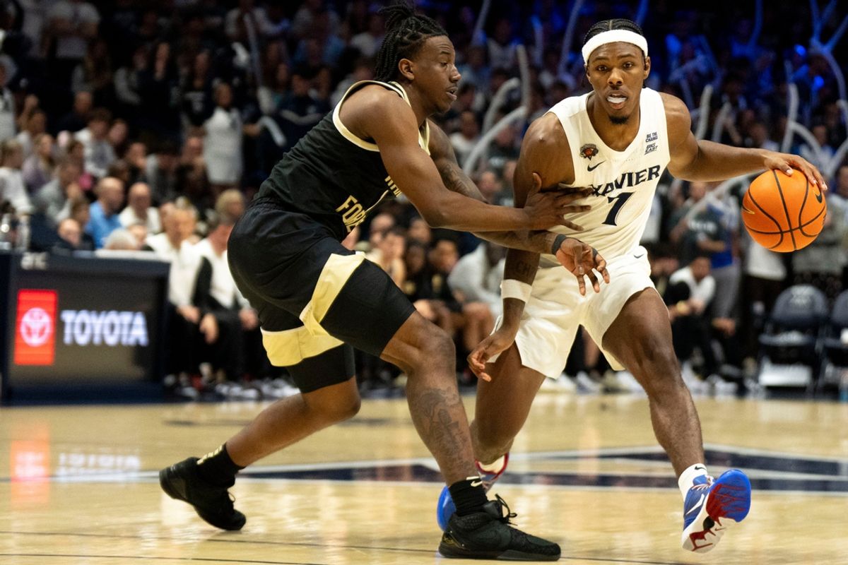Xavier Musketeers guard Ryan Conwell (7) handles the ball as Wake Forest Demon Deacons guard Davin Cosby (1) defends in the second half of the NCAA basketball game between Xavier Musketeers and Wake Forest Demon Deacons at the Cintas Center in Cincinnati on Saturday, Nov. 16, 2024.
