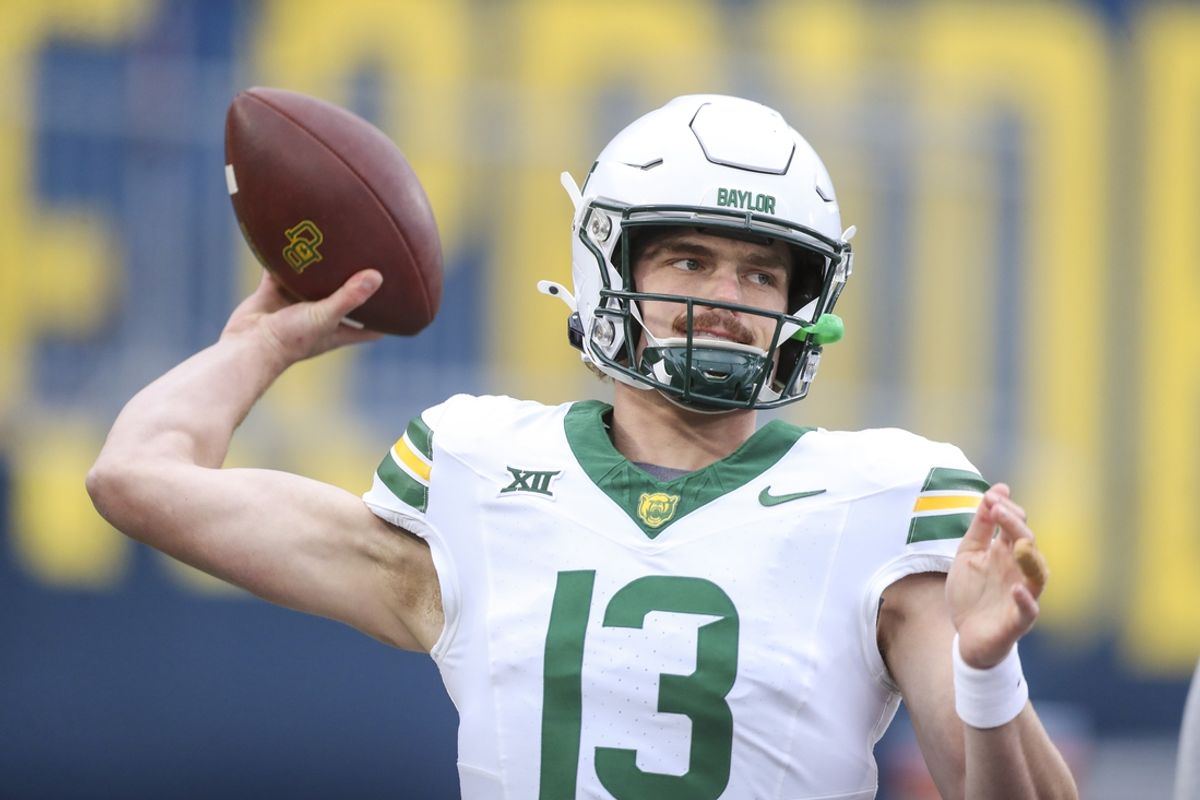 Nov 16, 2024; Morgantown, West Virginia, USA; Baylor Bears quarterback Sawyer Robertson (13) warms up prior to their game against the West Virginia Mountaineers at Mountaineer Field at Milan Puskar Stadium. Mandatory Credit: Ben Queen-Imagn Images