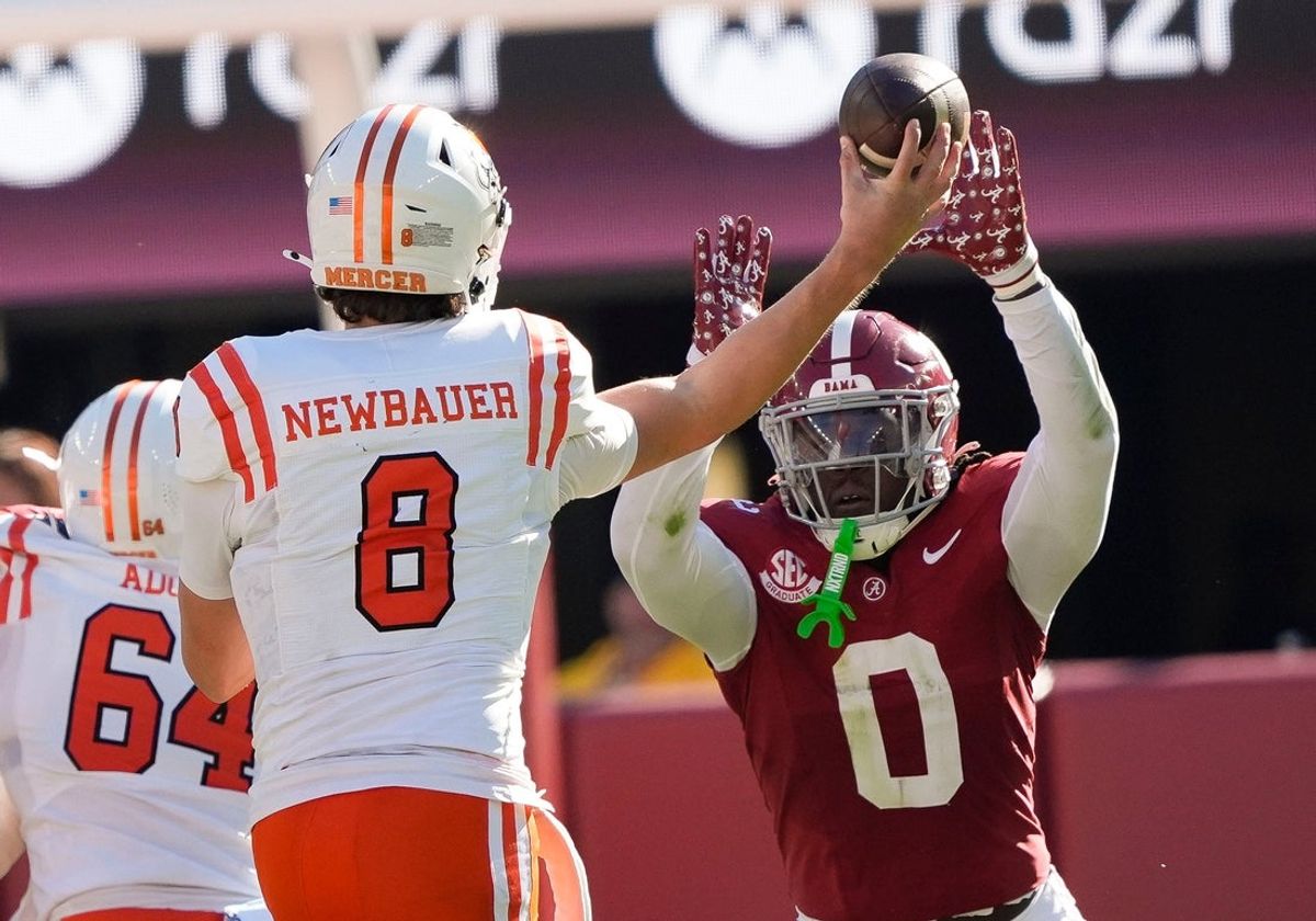 Nov 16, 2024; Tuscaloosa, AL, USA; Alabama Crimson Tide linebacker Deontae Lawson (0) deflects a pass from Mercer quarterback Whitt Newbauer (8) that was intercepted by Alabama at Bryant-Denny Stadium. Mandatory Credit: Gary Cosby Jr.-Tuscaloosa News