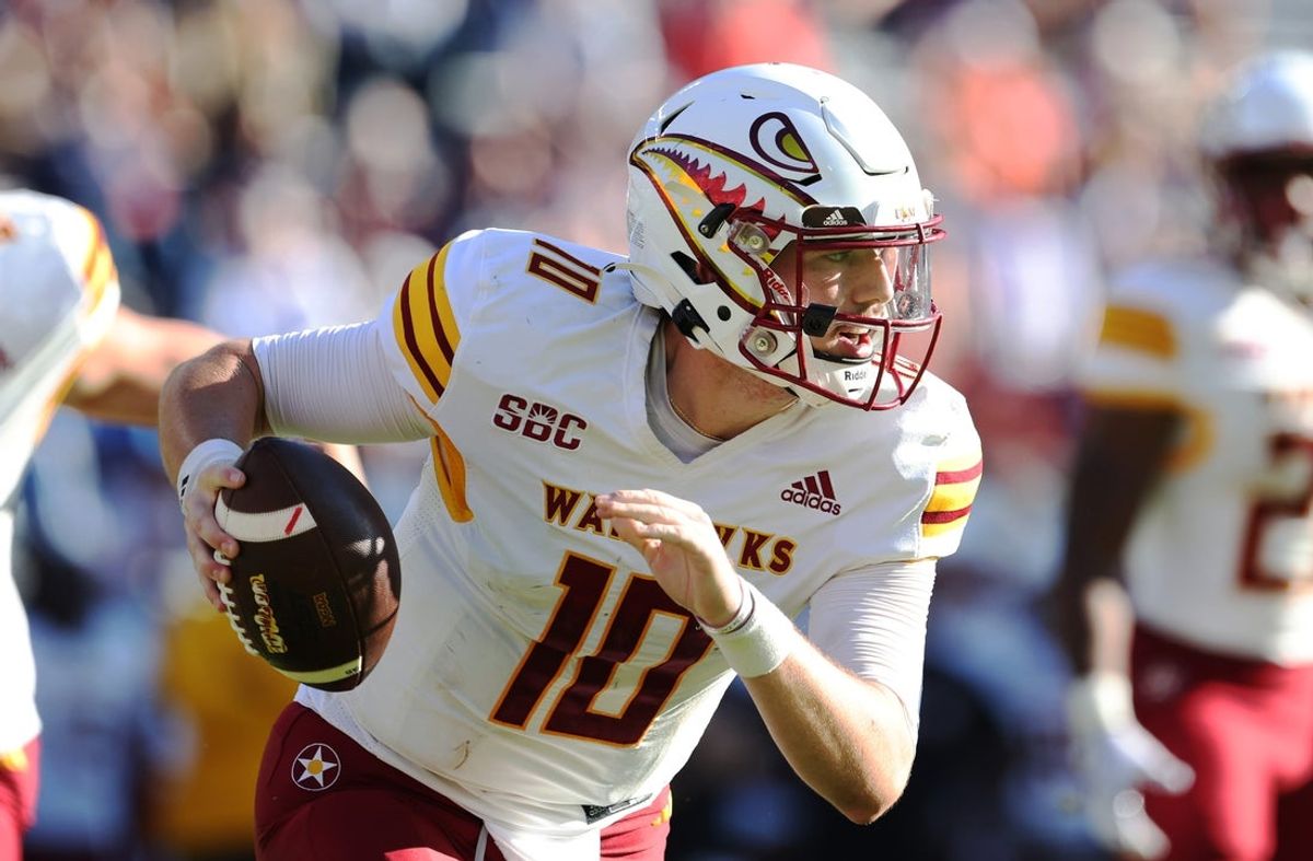 Nov 16, 2024; Auburn, Alabama, USA;  Louisiana Monroe Warhawks quarterback Aidan Armenta (10) scrambles from the pocket during the fourth quarter against the Auburn Tigers at Jordan-Hare Stadium.  Mandatory Credit: John Reed-Imagn Images