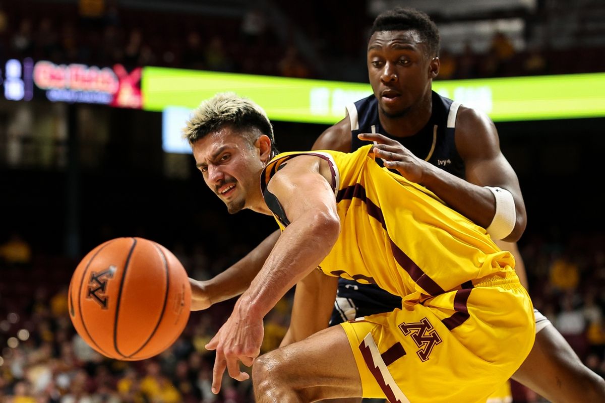 Nov 16, 2024; Minneapolis, Minnesota, USA; Yale Bulldogs forward Isaac Celiscar (8) and Minnesota Golden Gophers forward Dawson Garcia (3) compete for the ball during the first half at Williams Arena. Mandatory Credit: Matt Krohn-Imagn Images