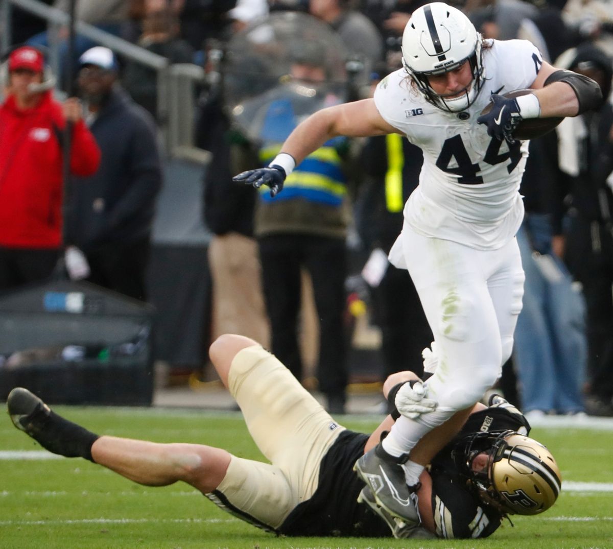 Purdue Boilermakers defensive end Will Heldt (15) tackles Penn State Nittany Lions tight end Tyler Warren (44) Saturday, Nov. 16, 2024, during the NCAA football game at Ross-Ade Stadium in West Lafayette, Ind.