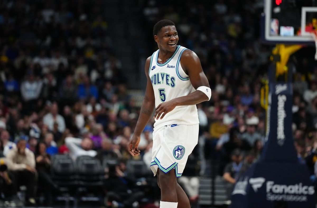 Mar 29, 2024; Denver, Colorado, USA; Minnesota Timberwolves guard Anthony Edwards (5) reacts in the second half against the Denver Nuggets at Ball Arena.