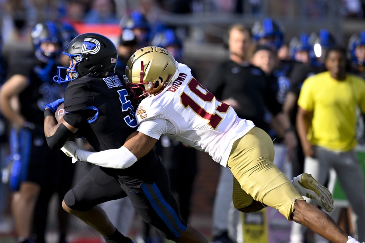 Nov 16, 2024; Dallas, Texas, USA; SMU Mustangs wide receiver Moochie Dixon (5) catches a pass as Boston College Eagles cornerback Bryquice Brown (19) defends during the first half at the Gerald J. Ford Stadium. Mandatory Credit: Jerome Miron-Imagn Images
