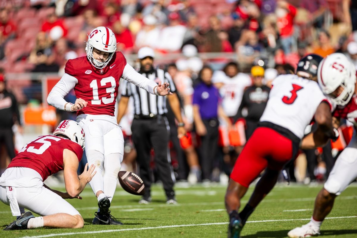 Nov 16, 2024; Stanford, California, USA; Stanford Cardinal place kicker Emmet Kenney (13) kicks a field goal during the first quarter against the Louisville Cardinals at Stanford Stadium. Mandatory Credit: Bob Kupbens-Imagn Images