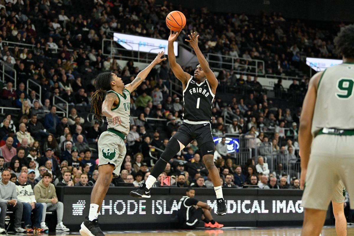 Nov 16, 2024; Providence, Rhode Island, USA; Providence Friars guard Jayden Pierre (1) shoots over Green Bay Phoenix guard Jeremiah Johnson (3) during the first half at Amica Mutual Pavilion. Mandatory Credit: Eric Canha-Imagn Images