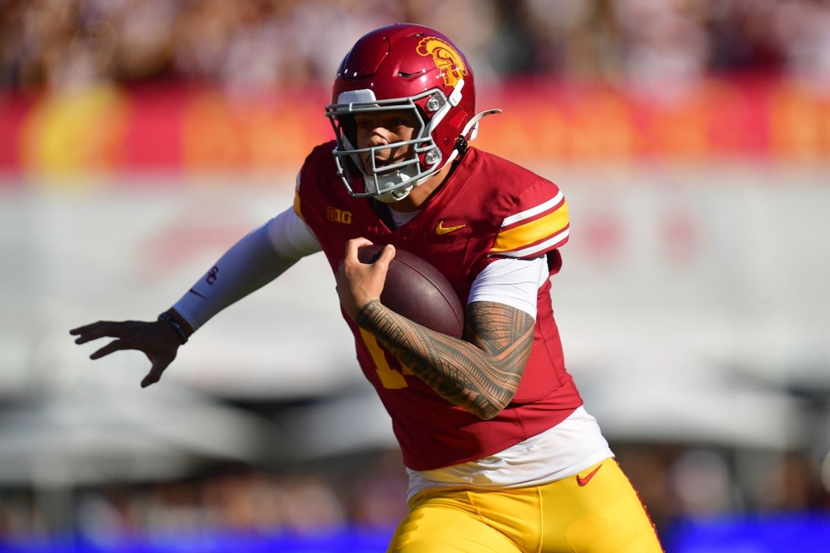Nov 16, 2024; Los Angeles, California, USA; Southern California Trojans quarterback Jayden Maiava (14) runs the ball against the Nebraska Cornhuskers during the first half at the Los Angeles Memorial Coliseum. Mandatory Credit: Gary A. Vasquez-Imagn Images