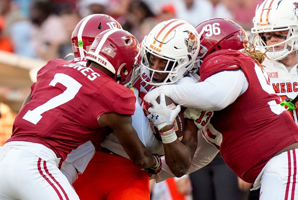 Nov 16, 2024; Tuscaloosa, AL, USA; Mercer wide receiver Kelin Parsons (13) is tackled by Alabama Crimson Tide defensive back DaShawn Jones (7) and Alabama Crimson Tide defensive lineman Tim Keenan III (96) at Bryant-Denny Stadium. Alabama defeated Mercer 52-7. Mandatory Credit: Gary Cosby Jr.-Tuscaloosa News
