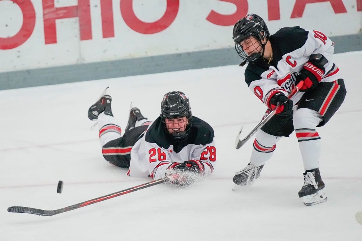 Ohio State Buckeyes forward Jenna Buglioni (10) passes the puck next to forward Sofie Lundin (28) in the first period at Ohio State Ice Rink on Saturday, Nov. 16, 2024 in Columbus, Ohio.