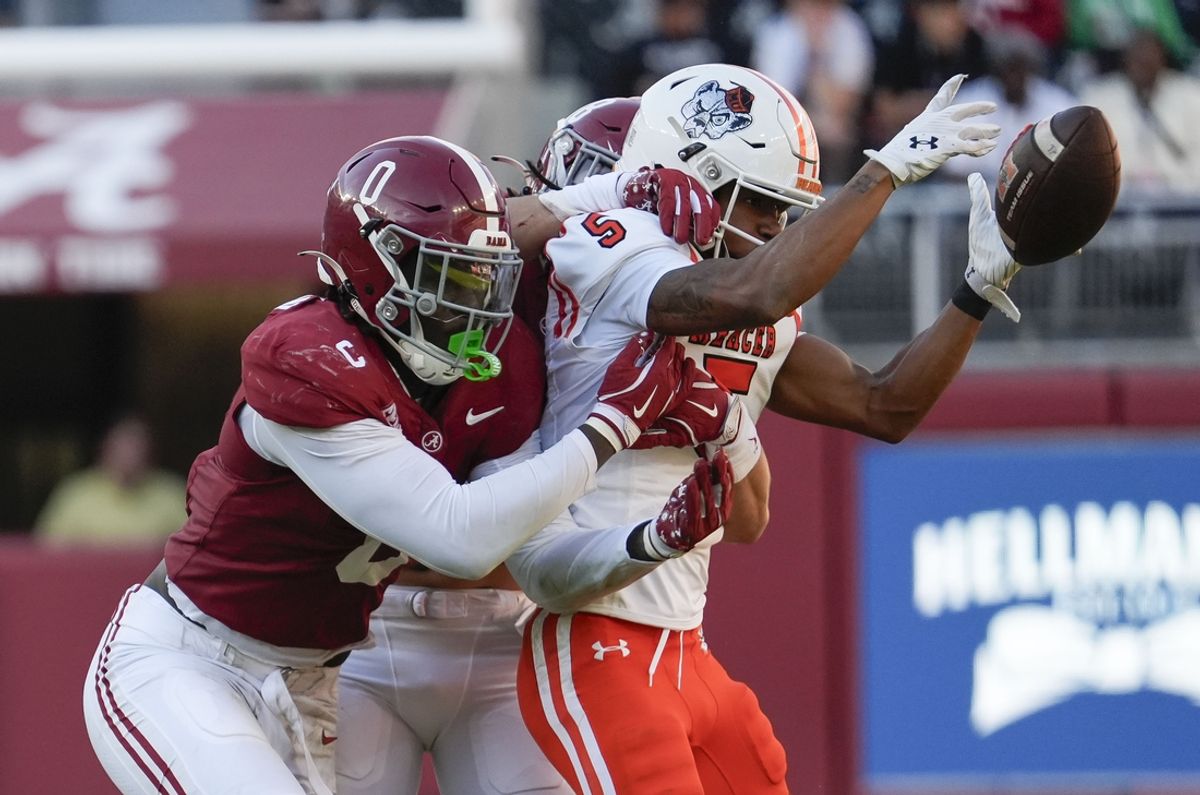 Nov 16, 2024; Tuscaloosa, AL, USA; Alabama Crimson Tide linebacker Deontae Lawson (0) and defensive back DeVonta Smith (8) break up a pass intended for Mercer Bears wide receiver Javarius George (5) at Bryant-Denny Stadium. Mandatory Credit: Gary Cosby Jr.-Imagn Images