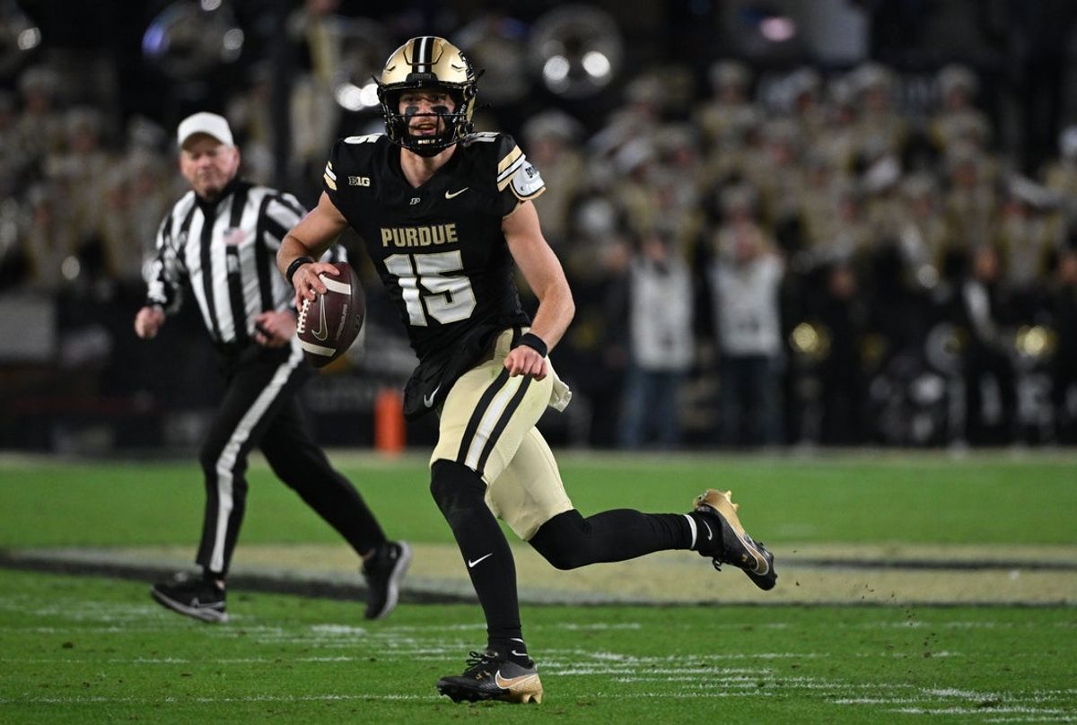 Nov 16, 2024; West Lafayette, Indiana, USA; Purdue Boilermakers quarterback Ryan Browne (15) runs the ball during the second half against the Penn State Nittany Lions at Ross-Ade Stadium. Mandatory Credit: Marc Lebryk-Imagn Images