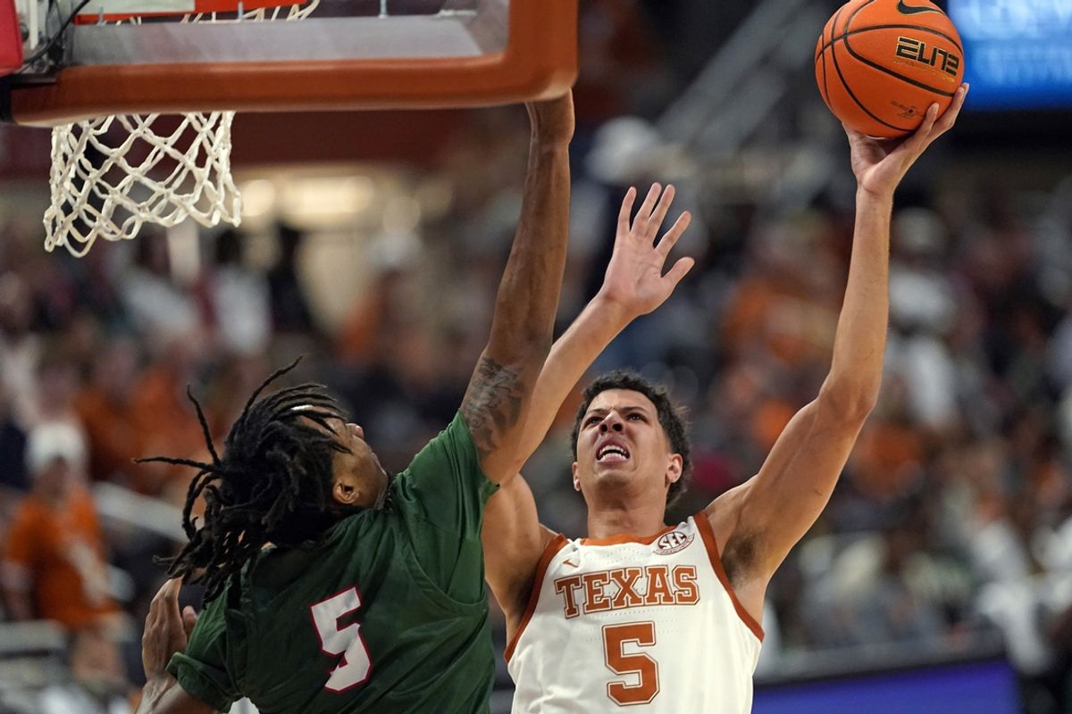 Nov 16, 2024; Austin, Texas, USA; Texas Longhorns forward Kadin Shedrick (5) shoots over Mississippi Valley State Delta Devils forward Walter Hamilton (5) during the second half at Moody Center. Mandatory Credit: Scott Wachter-Imagn Images