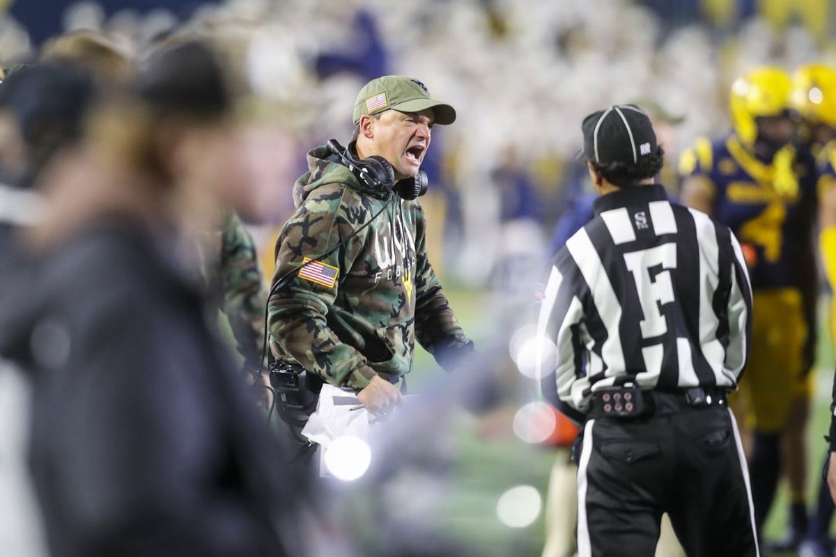 Nov 16, 2024; Morgantown, West Virginia, USA; West Virginia Mountaineers head coach Neal Brown argues a call during the fourth quarter against the Baylor Bears at Mountaineer Field at Milan Puskar Stadium. Mandatory Credit: Ben Queen-Imagn Images