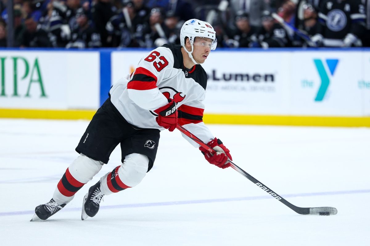 Nov 16, 2024; Tampa, Florida, USA; New Jersey Devils left wing Jesper Bratt (63) controls the puck against the Tampa Bay Lightning in the second period at Amalie Arena. Mandatory Credit: Nathan Ray Seebeck-Imagn Images