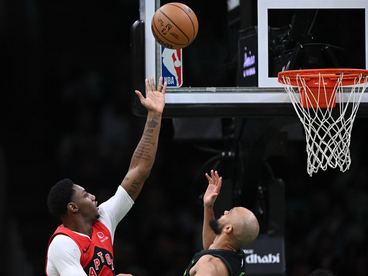 Nov 16, 2024; Boston, Massachusetts, USA; Toronto Raptors guard RJ Barrett (9) attempts a basket against Boston Celtics guard Derrick White (9) during the first half at the TD Garden. Mandatory Credit: Brian Fluharty-Imagn Images