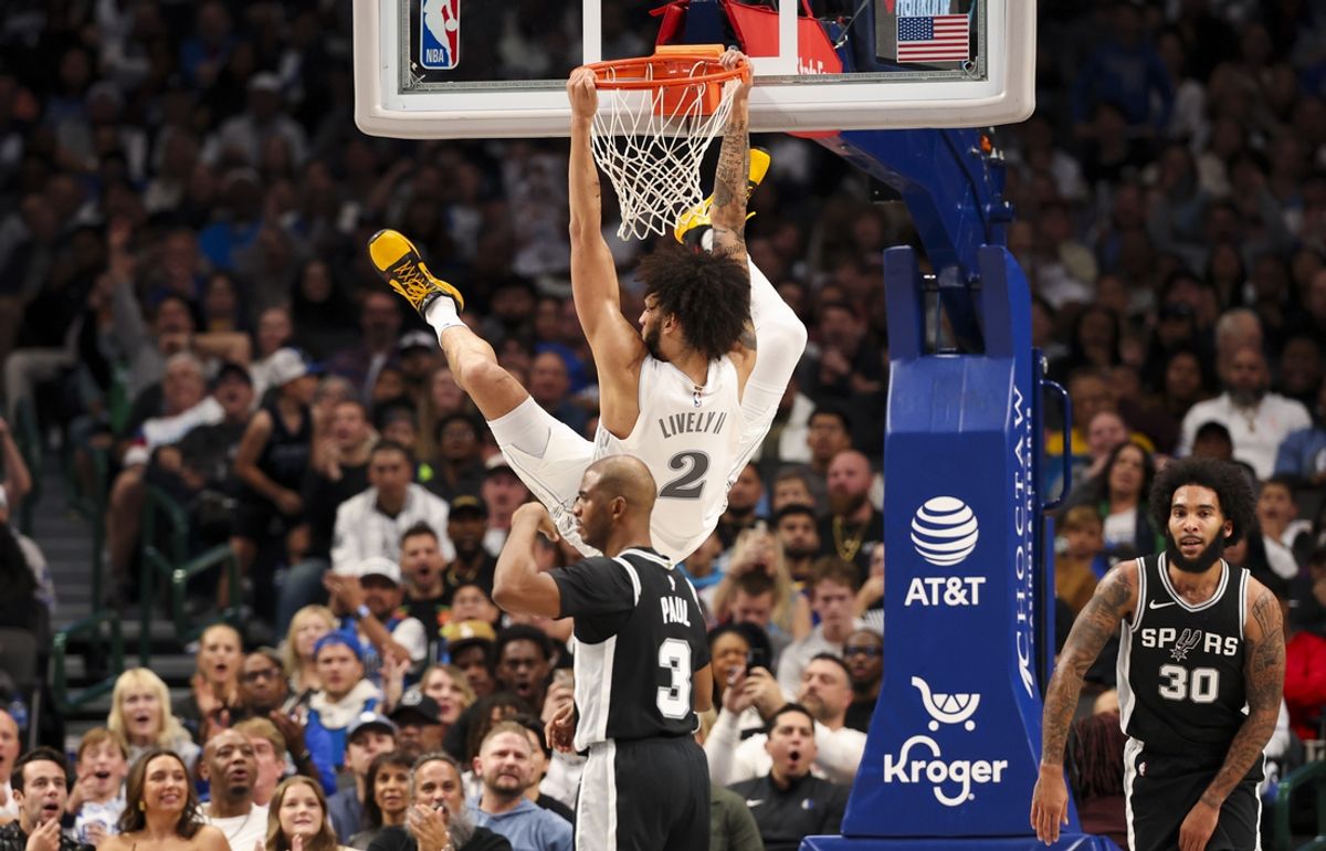 Nov 16, 2024; Dallas, Texas, USA;  Dallas Mavericks center Dereck Lively II (2) dunks over San Antonio Spurs guard Chris Paul (3) during the first half at American Airlines Center. Mandatory Credit: Kevin Jairaj-Imagn Images