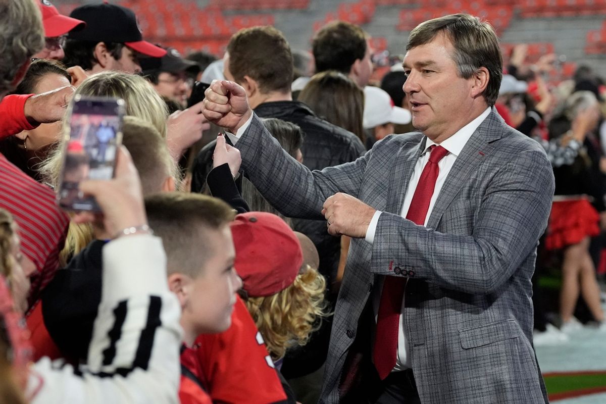 Georgia head coach Kirby Smart fist bumps fans during the Dawg Walk before the start of a NCAA college football game against Tennessee in Athens, Ga., on Saturday, Nov. 16, 2024.