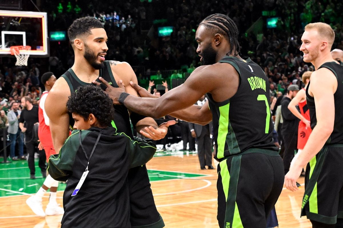 Nov 16, 2024; Boston, Massachusetts, USA; Boston Celtics forward Jayson Tatum (0) celebrates with guard Jaylen Brown (7) after making the game wining basket against the Toronto Raptors in overtime at the TD Garden. Mandatory Credit: Brian Fluharty-Imagn Images
