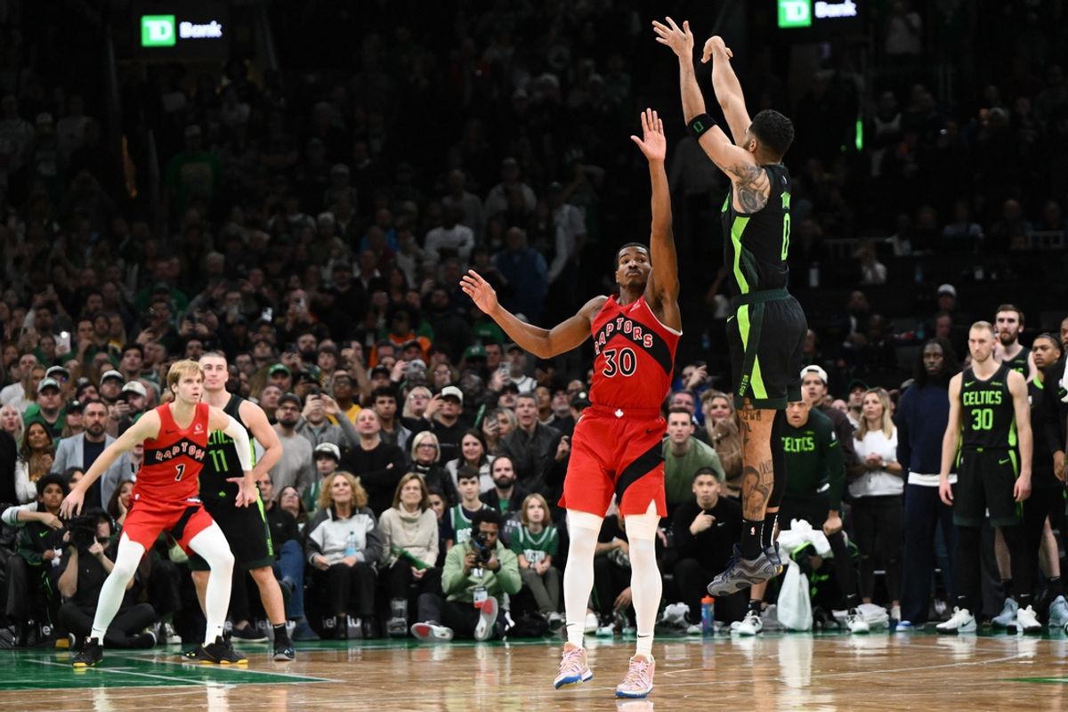 Nov 16, 2024; Boston, Massachusetts, USA; Boston Celtics forward Jayson Tatum (0) makes the game winning basket in overtime against the Toronto Raptors at the TD Garden. Mandatory Credit: Brian Fluharty-Imagn Images