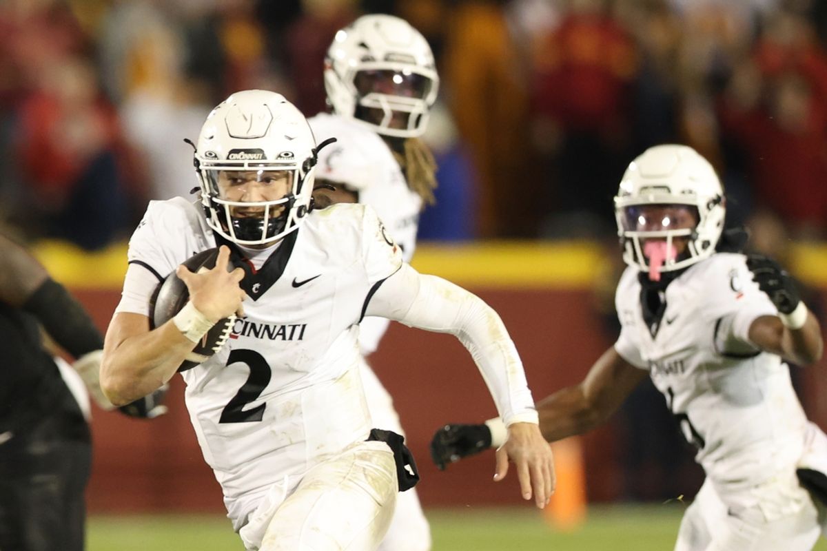 Nov 16, 2024; Ames, Iowa, USA; Cincinnati Bearcats quarterback Brendan Sorsby (2) runs for a touchdown against the Iowa State Cyclones at Jack Trice Stadium. The Iowa State Cyclones won the game 34-17.  Mandatory Credit: Reese Strickland-Imagn Images