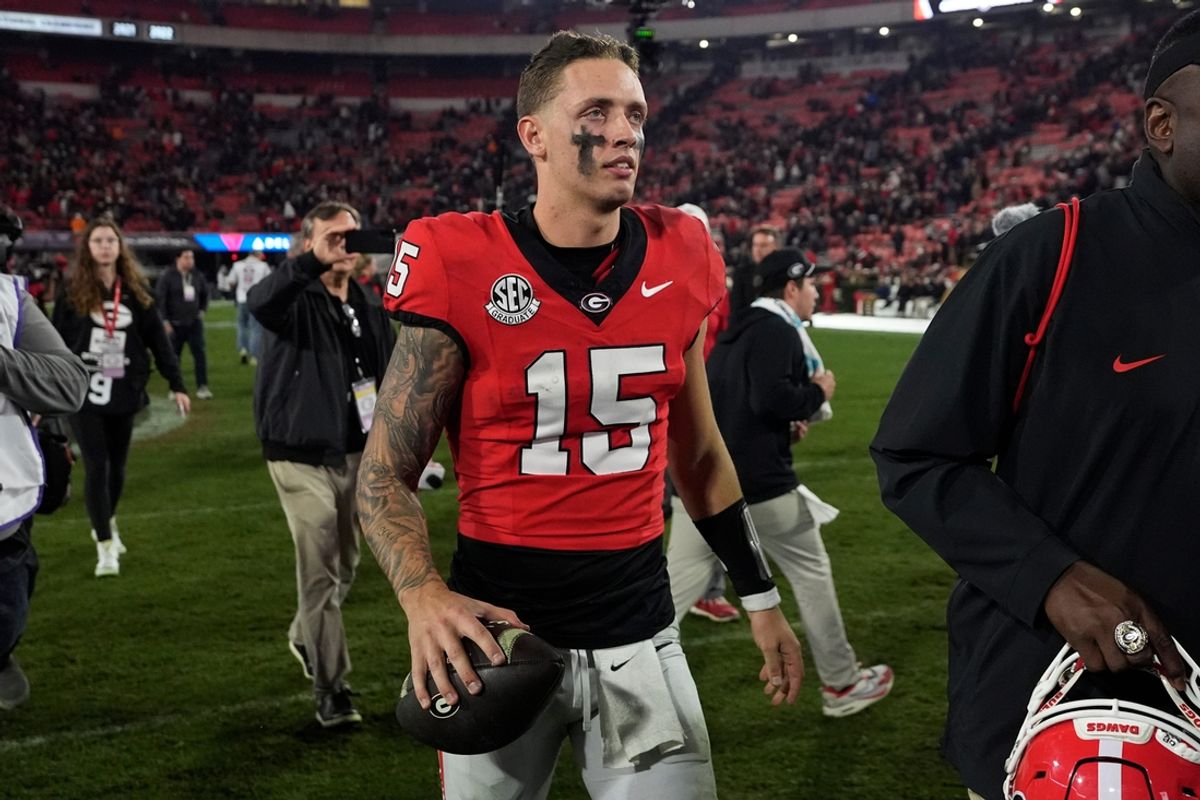 Georgia quarterback Carson Beck (15) leaves the field after winning a NCAA college football game against Tennessee in Athens, Ga., on Saturday, Nov. 16, 2024.