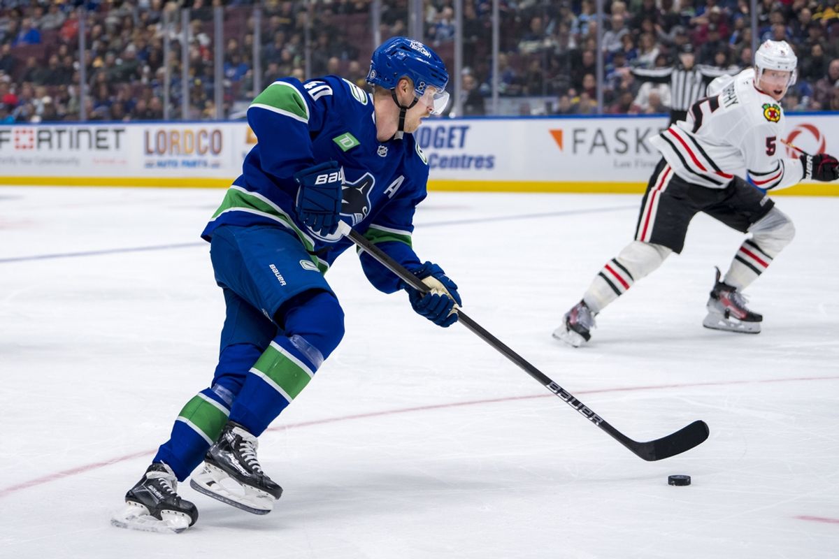 Nov 16, 2024; Vancouver, British Columbia, CAN; Vancouver Canucks forward Elias Pettersson (40) handles the puck against the Chicago Blackhawks during the third period at Rogers Arena. Mandatory Credit: Bob Frid-Imagn Images