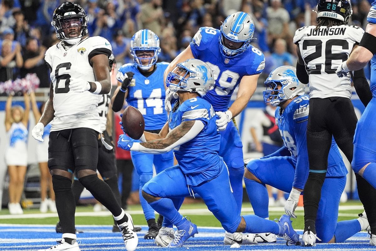 Nov 17, 2024; Detroit, MI, USA; Detroit Lions running back David Montgomery (5) celebrates scoring a touchdown against Jacksonville Jaguars during the first half at Ford Field in Detroit on Sunday, Nov. 17, 2024. Mandatory Credit: Junfu Han/USA TODAY Network via Imagn Images