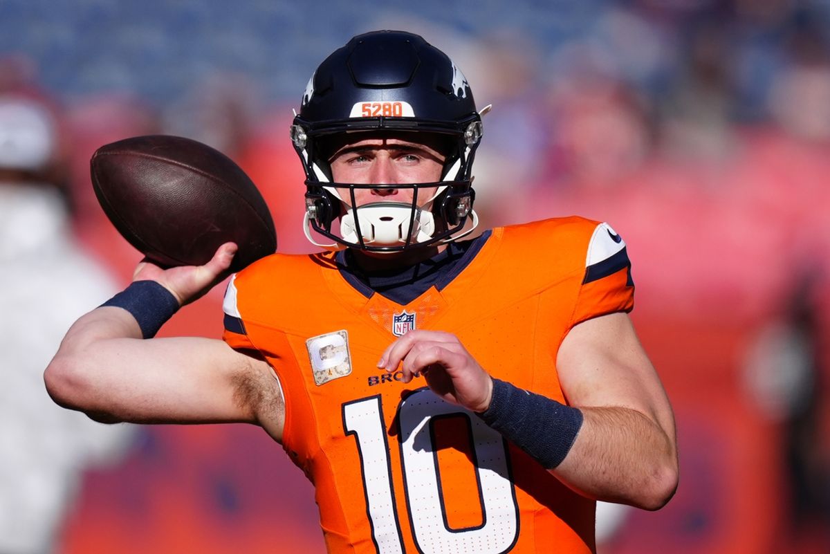 Nov 17, 2024; Denver, Colorado, USA;  Denver Broncos quarterback Bo Nix (10) warms before the game against the Atlanta Falcons at Empower Field at Mile High. Mandatory Credit: Ron Chenoy-Imagn Images