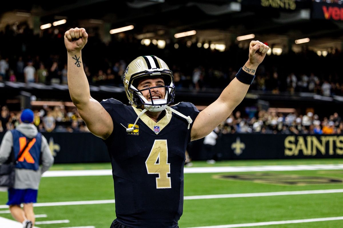 Nov 17, 2024; New Orleans, Louisiana, USA;  New Orleans Saints quarterback Derek Carr (4) reacts after tight end Taysom Hill (not pictured) scores a touchdown against the Cleveland Browns during the second half at Caesars Superdome. Mandatory Credit: Stephen Lew-Imagn Images