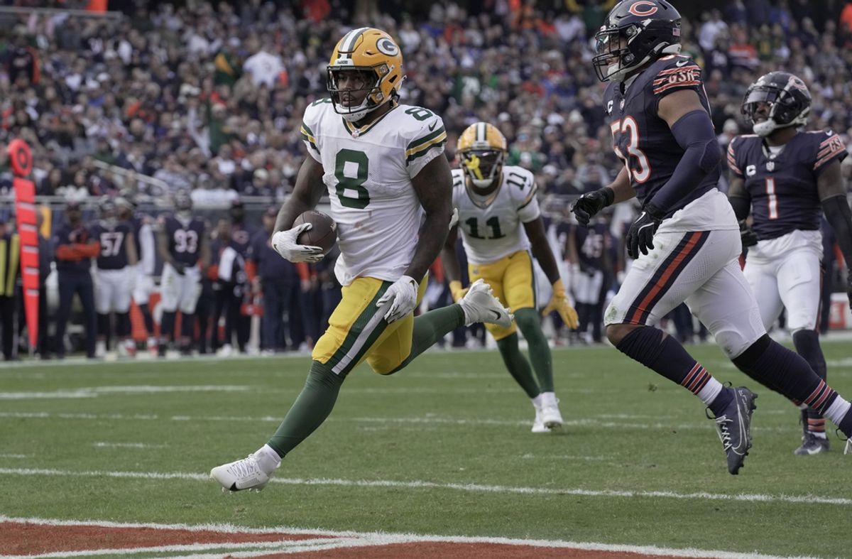 Nov 17, 2024; Chicago, Illinois, USA; Green Bay Packers running back Josh Jacobs (8) scores a touchdown on seven yard run during the third quarter of their game Sunday, November 17, 2024 at Soldier Field in Chicago, Illinois. The Green Bay Packers beat the Chicago Bears 20-19. Mandatory Credit: Mark Hoffman/USA TODAY Network via Imagn Images