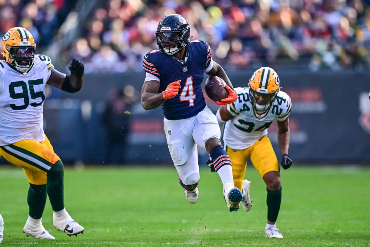 Nov 17, 2024; Chicago, Illinois, USA; Chicago Bears running back D'Andre Swift (4) runs for a 39 yard touchdown against the Green Bay Packers during the third quarter at Soldier Field. Mandatory Credit: Daniel Bartel-Imagn Images