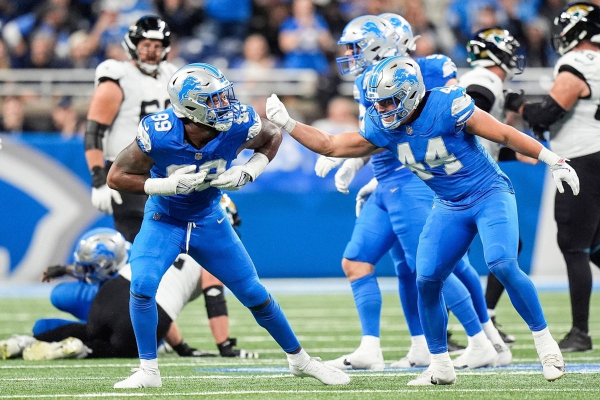 Detroit Lions defensive end Za'Darius Smith (99) celebrates a sack against Jacksonville Jaguars with linebacker Malcolm Rodriguez (44) during the second half at Ford Field in Detroit on Sunday, Nov. 17, 2024.