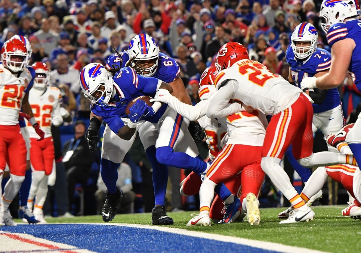 Nov 17, 2024; Orchard Park, New York, USA; Buffalo Bills running back James Cook (4) scores a touchdown against the Kansas City Chiefs in the second quarter at Highmark Stadium. Mandatory Credit: Mark Konezny-Imagn Images
